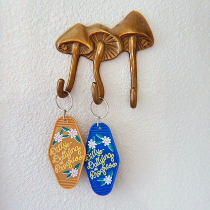 Dilly-Dallying in Progress Keychain, Tan and Silver