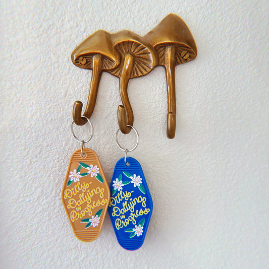 Dilly-Dallying in Progress Keychain, Tan and Silver